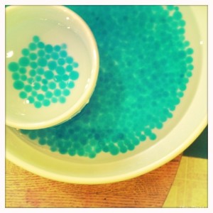 blue water beads in water